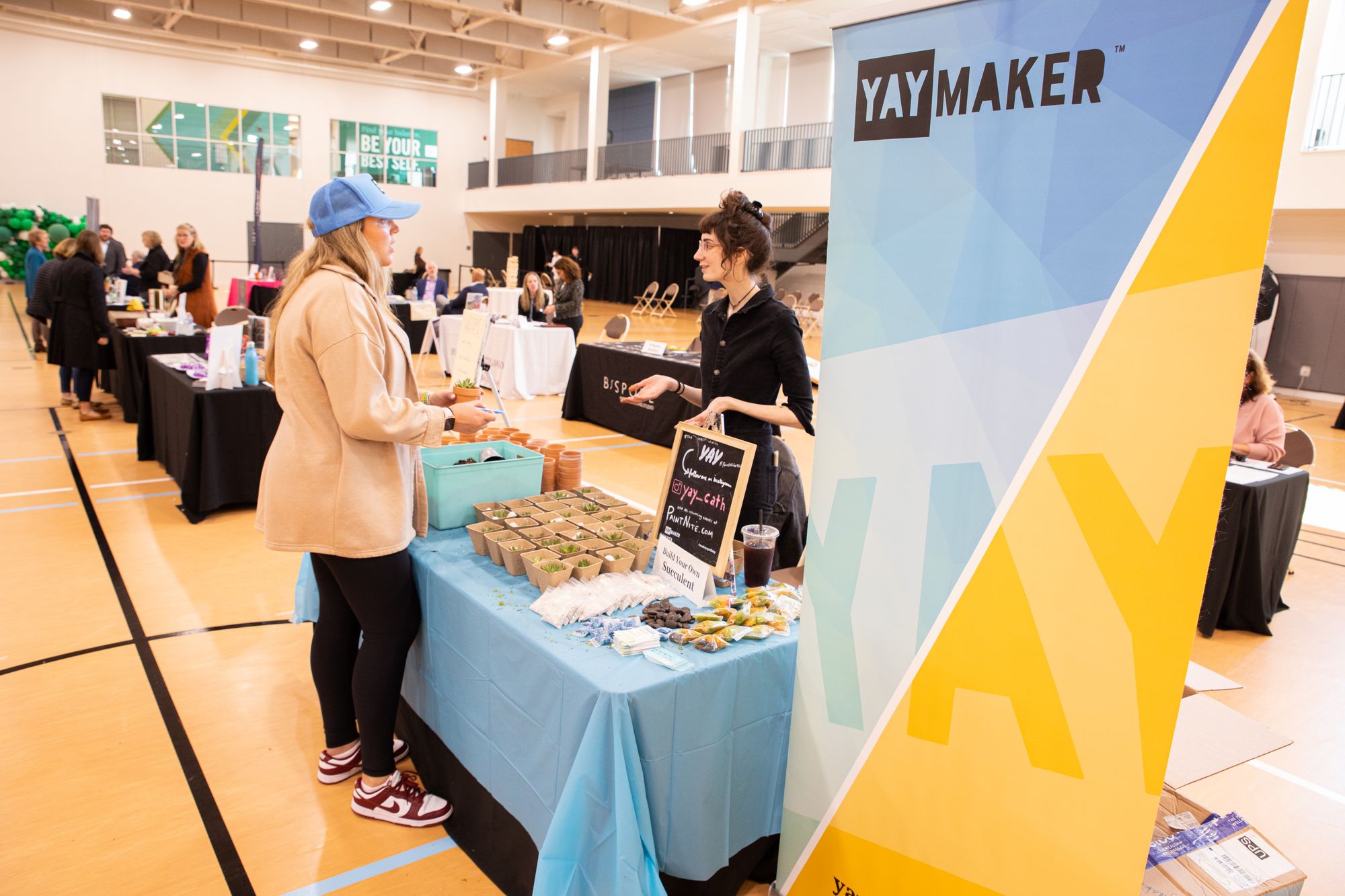 Yaymaker Plant Nite booth at a Babson College event