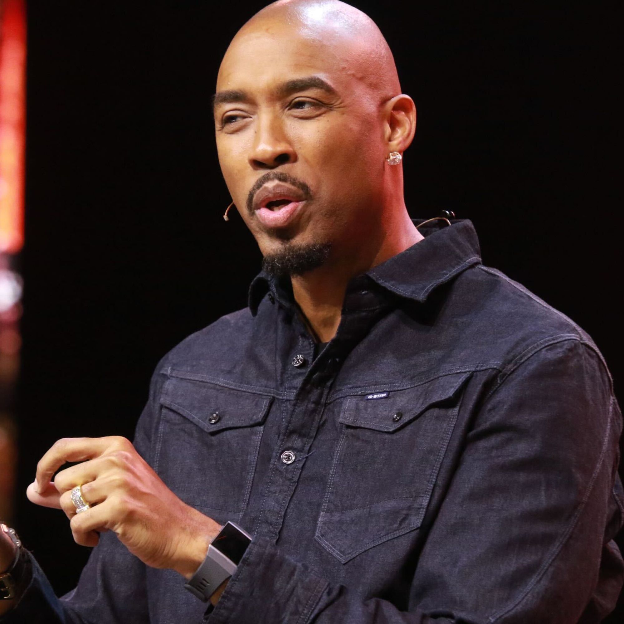 Keynote speaker Montell Jordan on stage at a conference