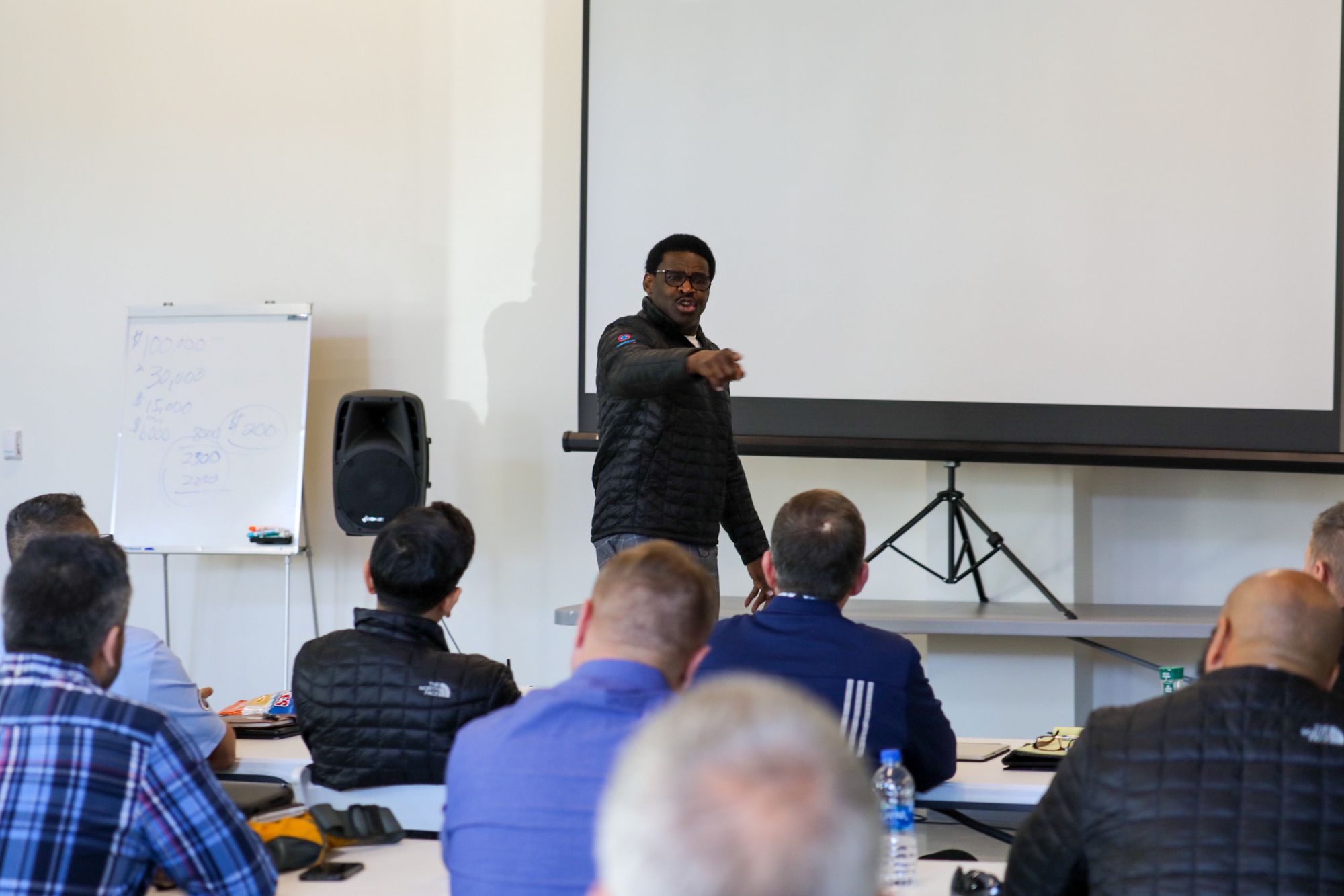 Michael Irvin (I.B.C.) at the front of a conference hall