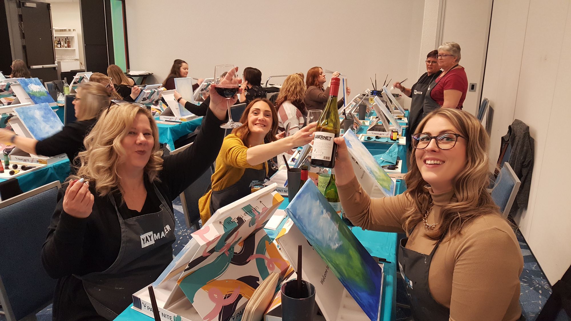 Group of women at a Yaymaker Paint Nite.