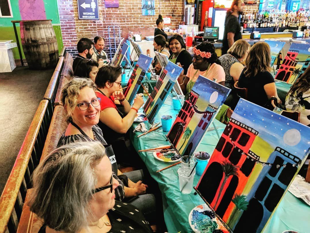 Large group at a Paint Nite corporate event with Yaymaker