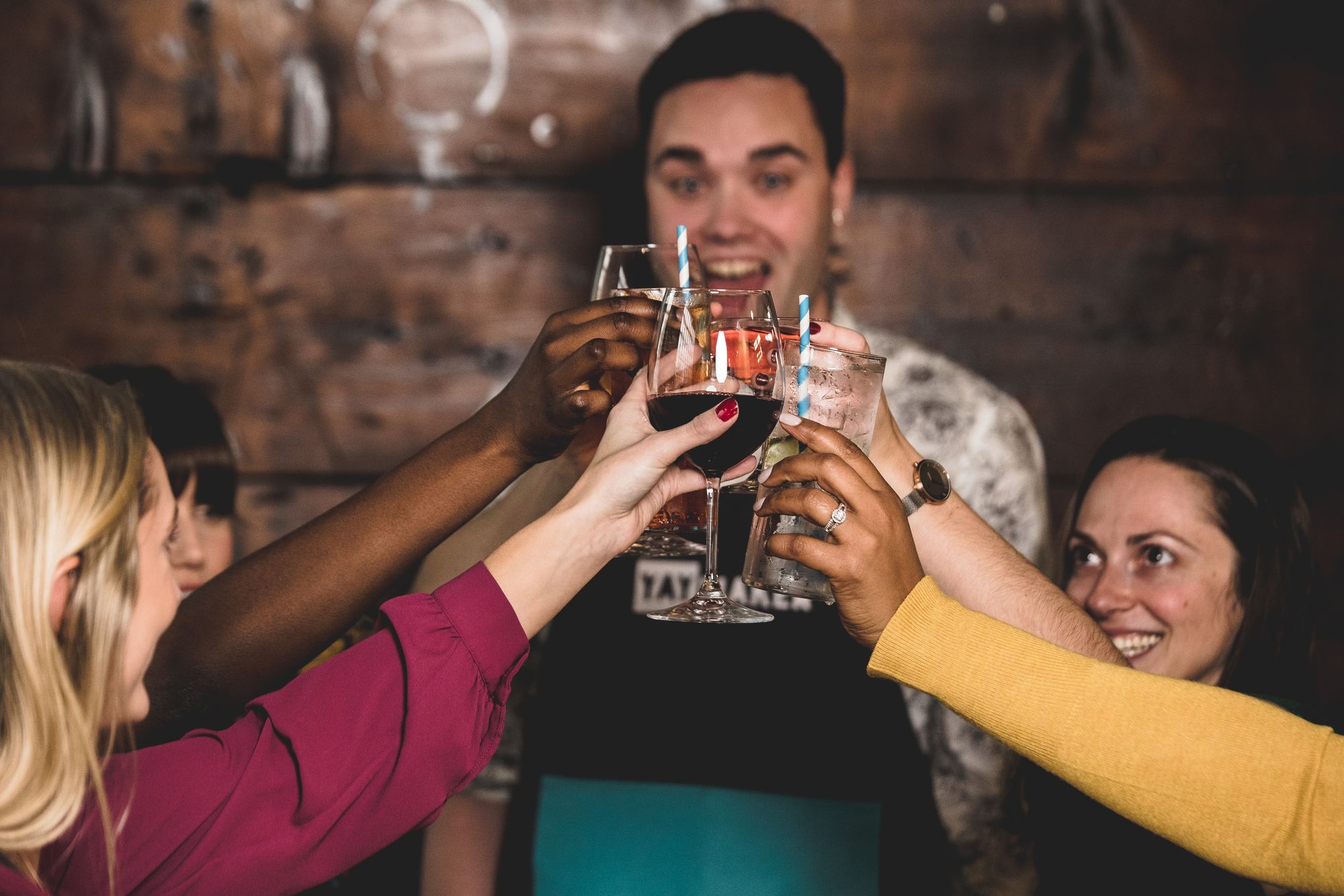 Group of friends cheersing at Yaymaker fundraiser event