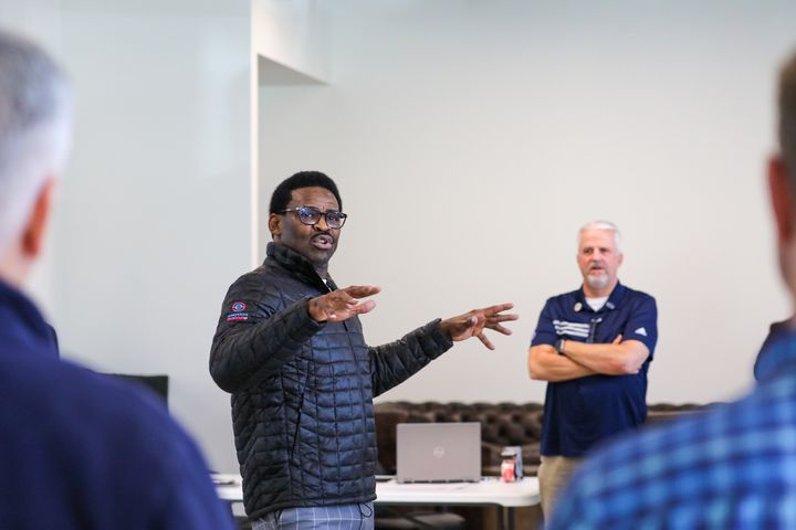 Michael Irvin (I.B.C.) running an in-person company event